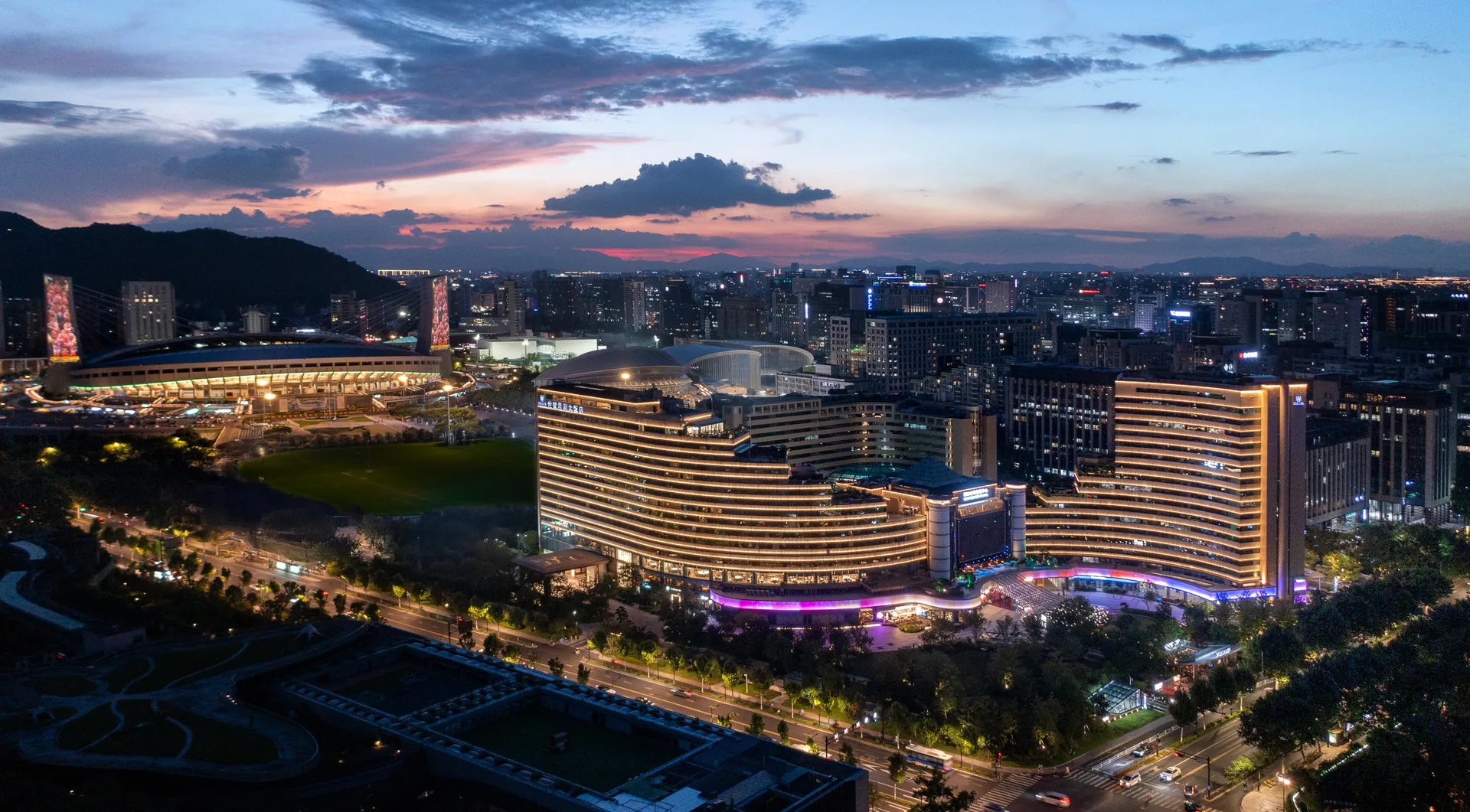 Exterior view of Zhejiang Narada Grand Hotel at dusk